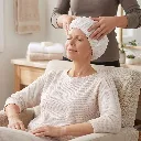 Woman_massaging_hair_with_cap_2K_20261012105854.webp